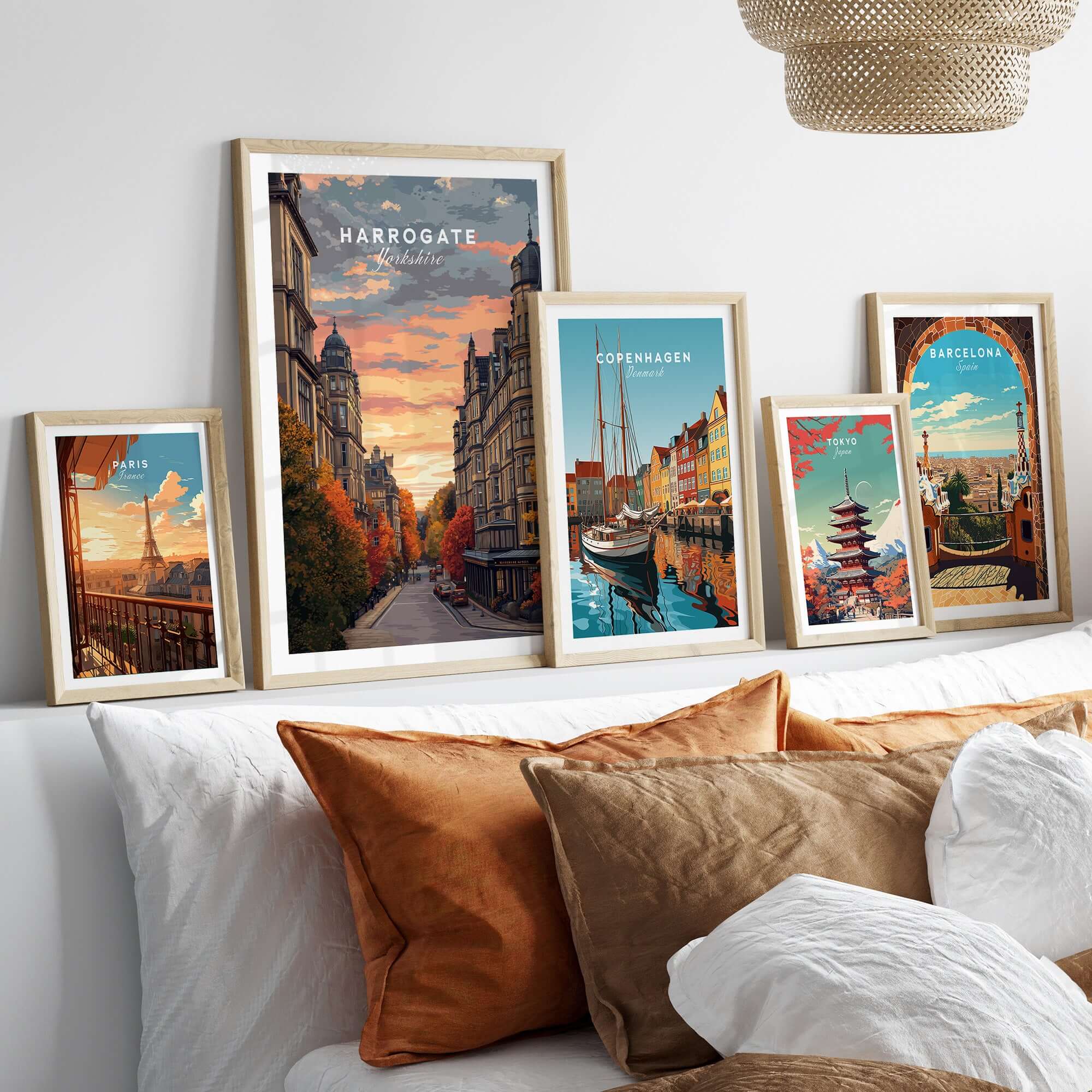 Harrogate Print | English Travel Wall Decor displayed in stylish frames on a cozy bed setting.