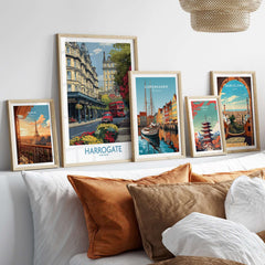 Harrogate Yorkshire Print | Floral Street Scene Poster displayed among other city prints on a stylish couch.
