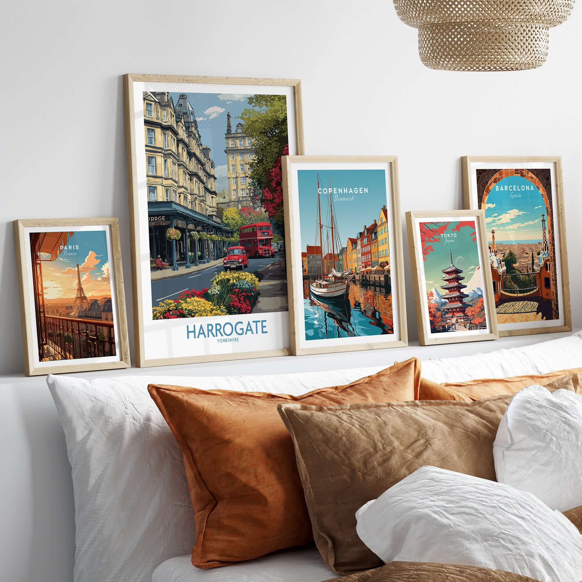 Harrogate Yorkshire Print | Floral Street Scene Poster displayed among other city prints on a stylish couch.