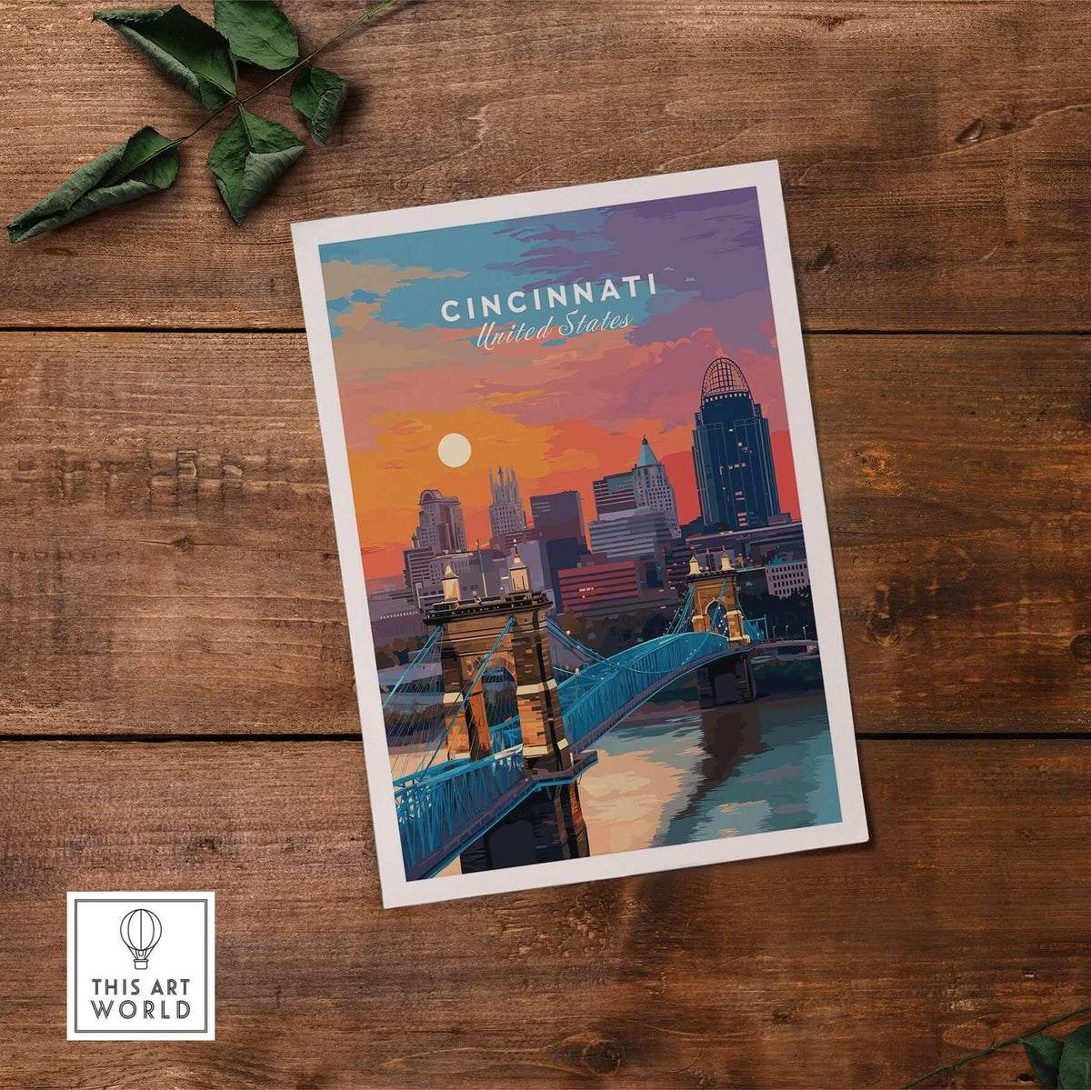 Cincinnati Ohio Sunset Skyline Poster - Roebling Bridge Wall Art on wooden surface with greenery