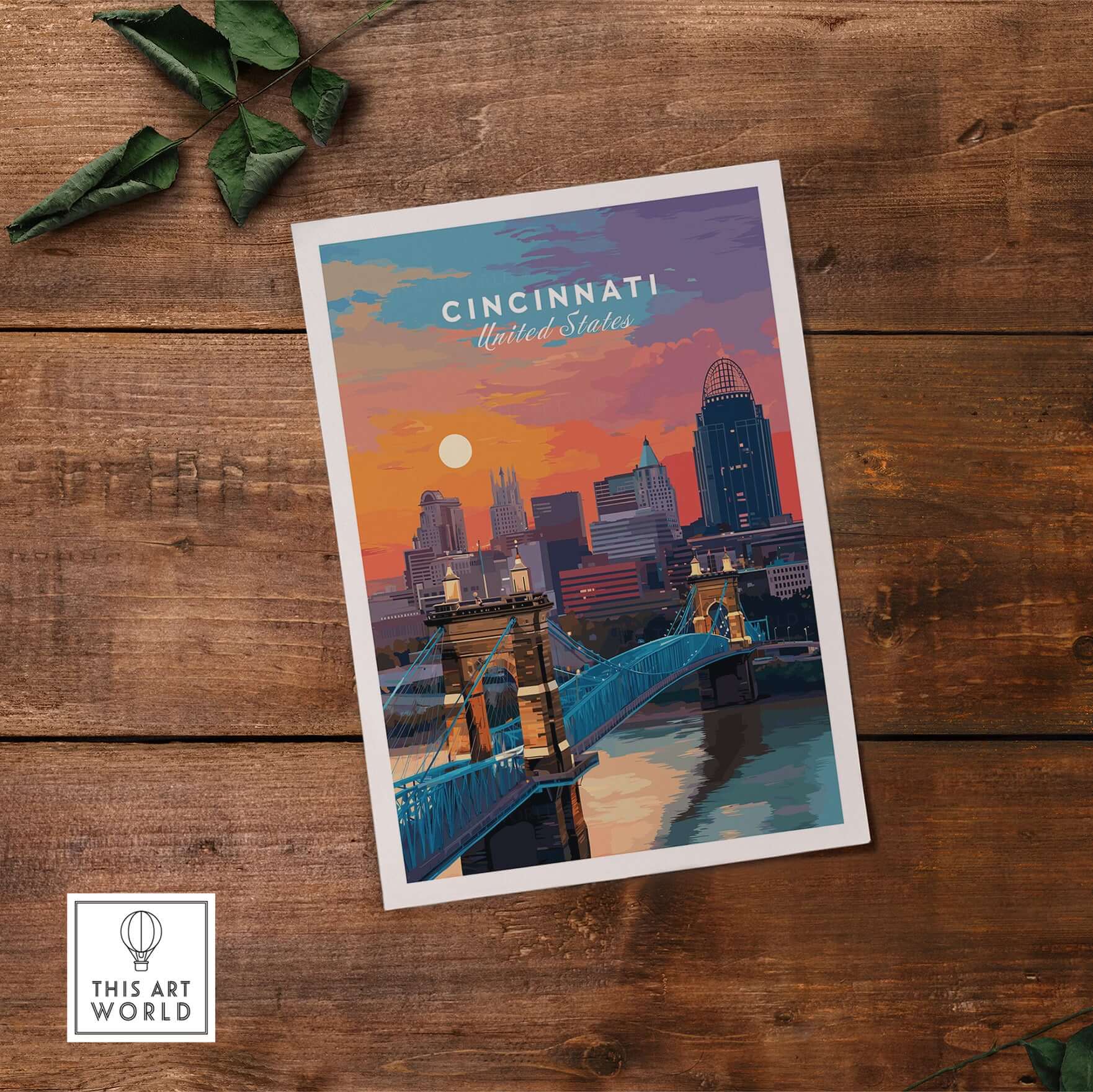 Cincinnati Ohio Sunset Skyline Poster - Roebling Bridge Wall Art on wooden surface with greenery