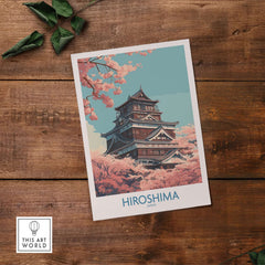 Hiroshima Wall Art Print Japan Cherry Blossom Poster featuring a beautiful castle surrounded by pink cherry blossoms.