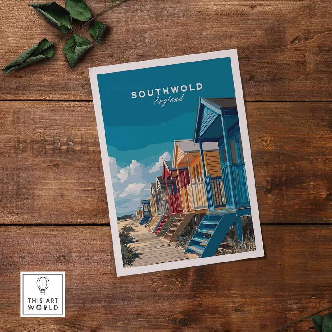 Southwold England colorful beach huts print on wooden table with green leaves, vibrant coastal wall art.