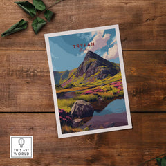 Tryfan Wales Mountain Landscape Print - Snowdonia Valley Wall Art on a wooden surface with vibrant colors.