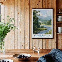 Framed Balmoral Castle travel poster on rustic wood kitchen wall with fruit bowls and flowers