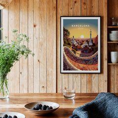 Barcelona Travel Poster Print displayed on a wooden wall, showcasing vibrant colors of Catalan architecture.