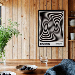 Bauhaus Exhibition Prints -  Optical Wave Lines Art Print Black Cream Abstract displayed in a wooden interior.