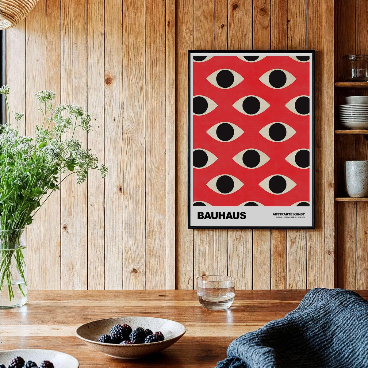 Bauhaus Exhibition Prints - Repeating Eyes Pattern Poster Red Black Cream Art displayed in a cozy home setting.