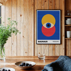 Bauhaus Exhibition Prints - Abstract Eye Circles Poster - Blue Yellow Red Primary Art displayed in a modern interior.