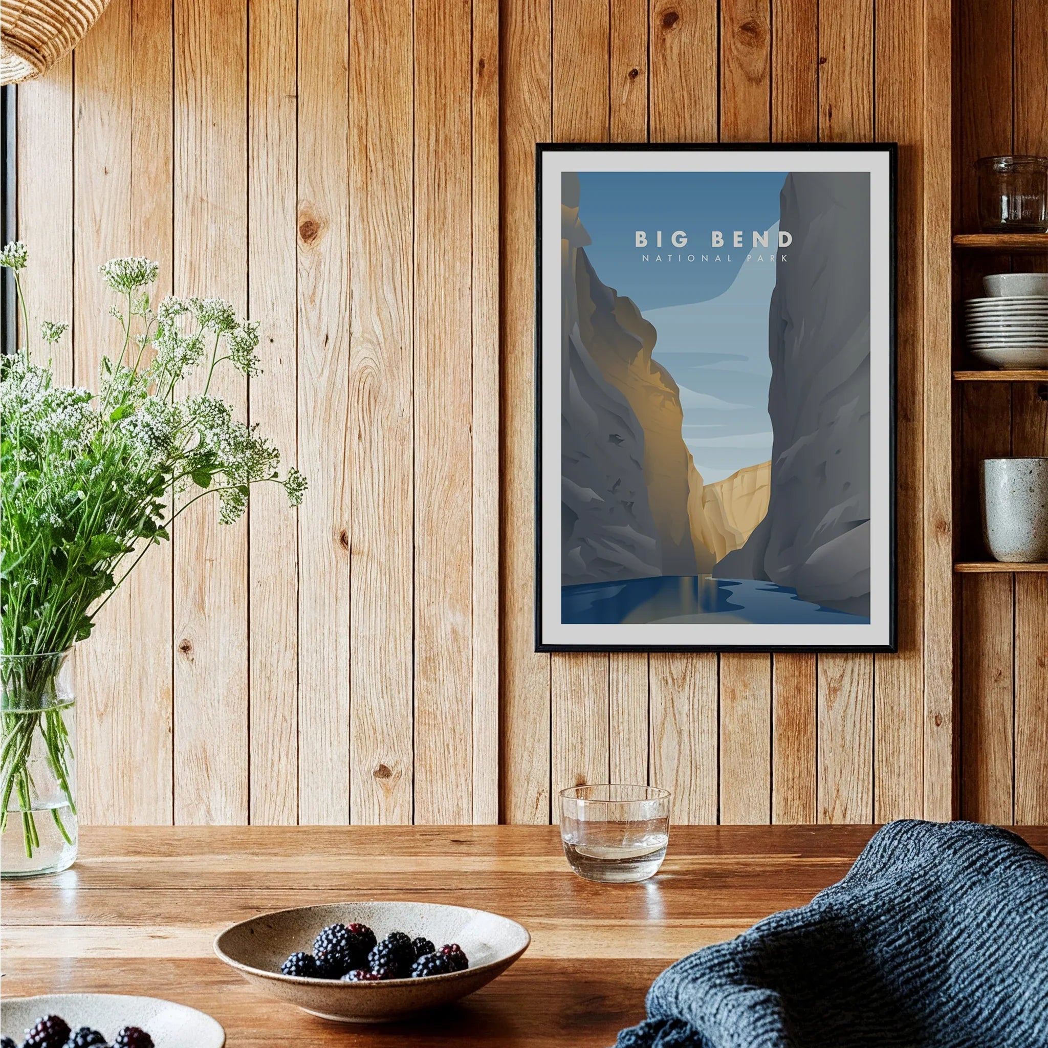 Big Bend National Park art print with canyon scene in black frame, displayed in a rustic kitchen.