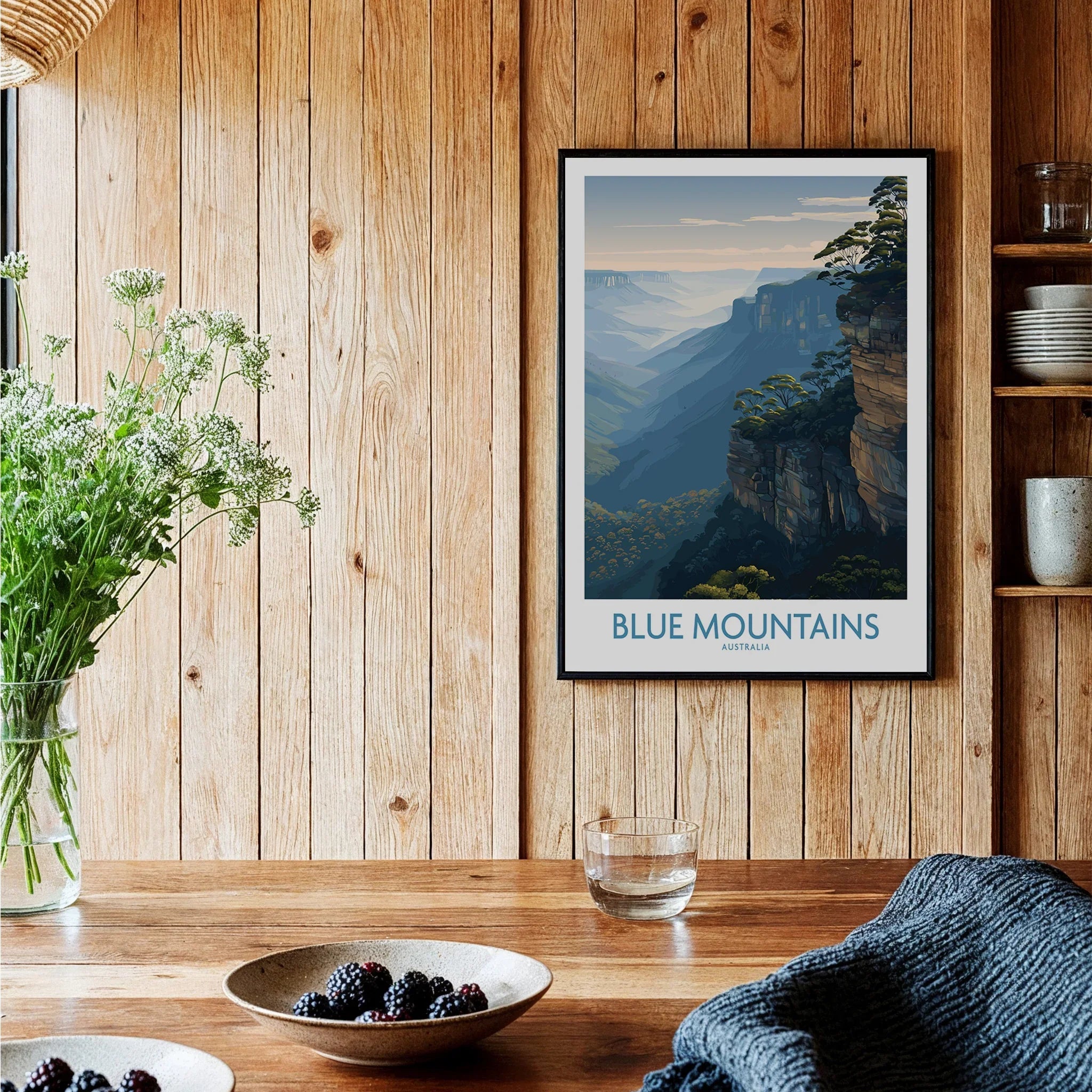 Blue Mountains art print in black frame on wooden kitchen wall, cozy rustic decor