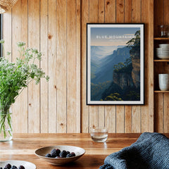 Blue Mountains Australia art print in black frame, hanging in rustic kitchen setting