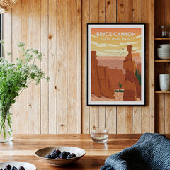 Bryce Canyon National Park art print in black frame on rustic kitchen wall with berries on table