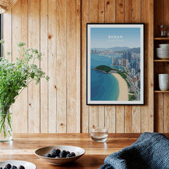 Framed Busan South Korea city skyline art print on wood wall in a cozy kitchen setting