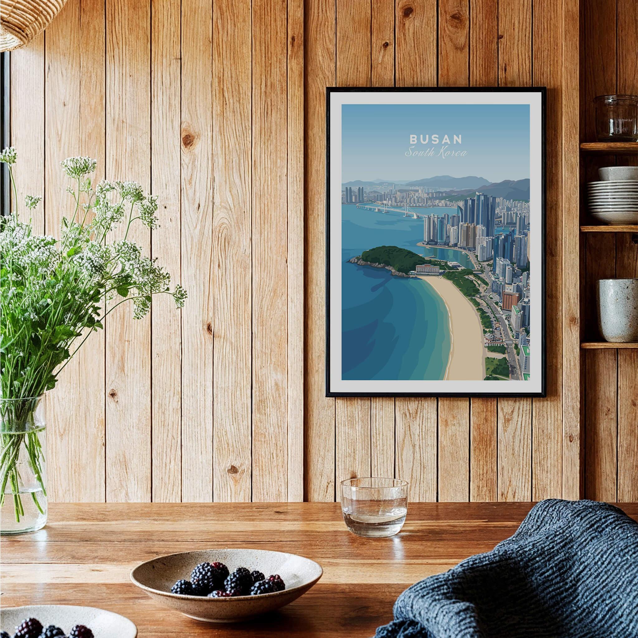 Framed Busan South Korea city skyline art print on wood wall in a cozy kitchen setting