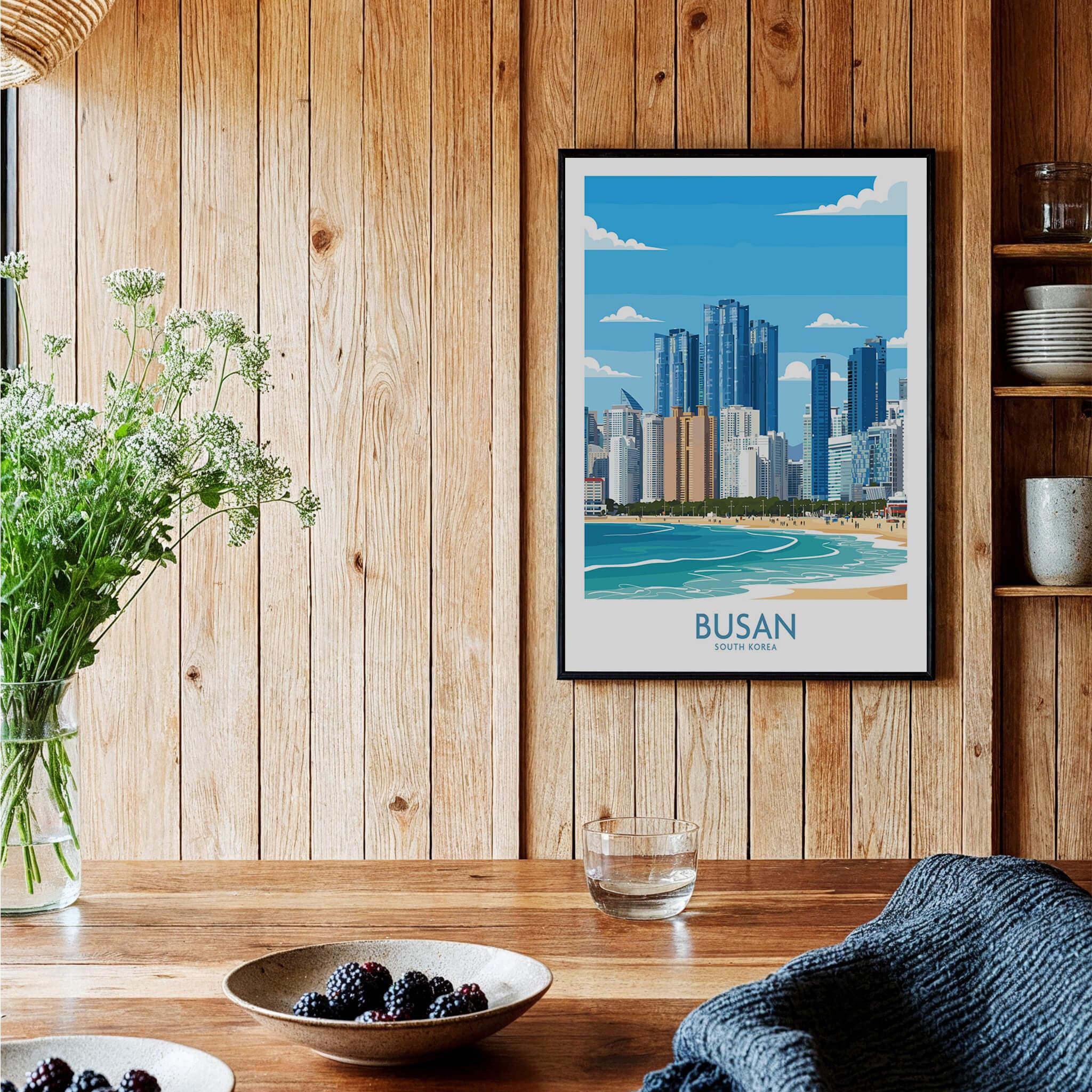 Framed Busan city skyline art print in a rustic kitchen setting with wood panel walls