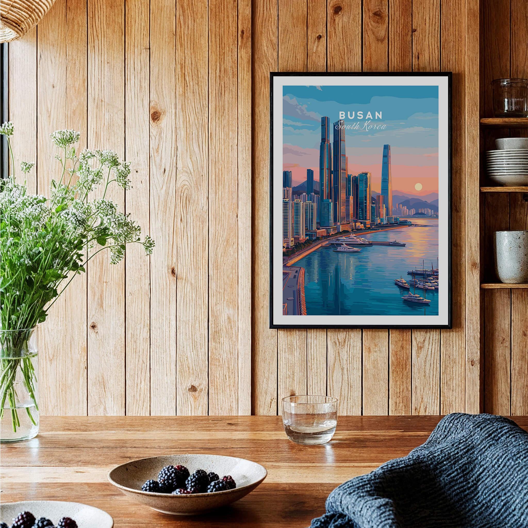 Framed Busan South Korea city skyline travel poster in cozy wooden kitchen setting