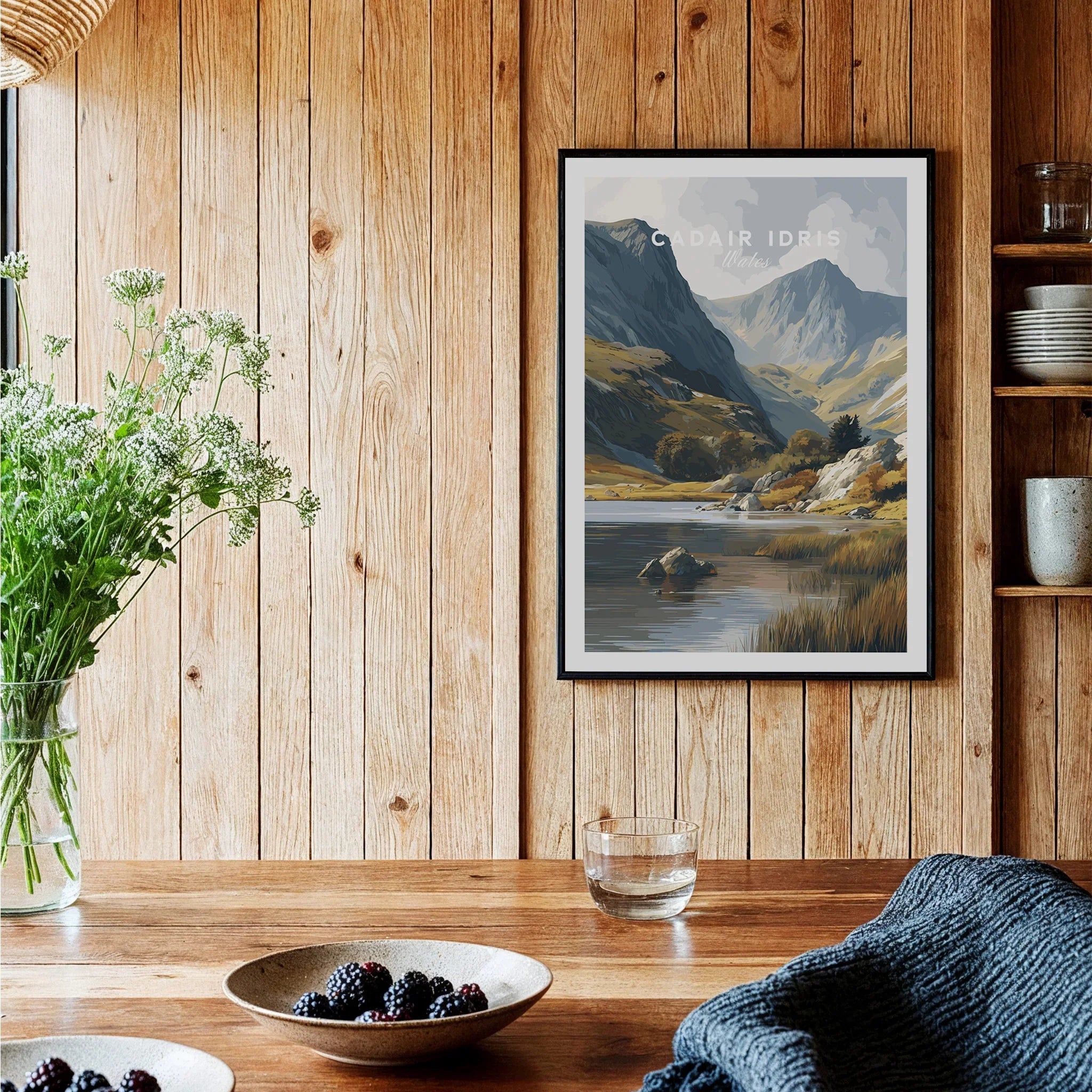 Framed Cadair Idris travel art print hanging in rustic wooden kitchen setting
