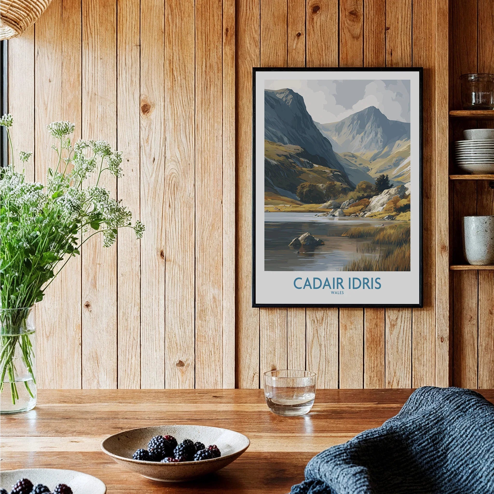 Framed Cadair Idris Wales art print in rustic kitchen with wood walls and modern decor.
