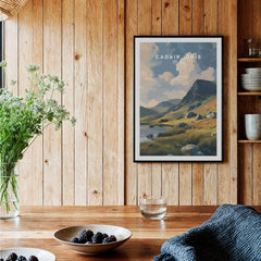 Framed Cadair Idris art print in rustic kitchen with wood panel walls and wildflower bouquet