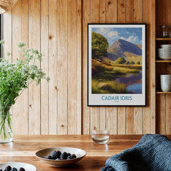 Framed Cadair Idris travel poster print on wooden kitchen wall, rustic decor setting