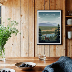 Framed Cairngorms National Park travel art print in rustic kitchen wall decor setting.
