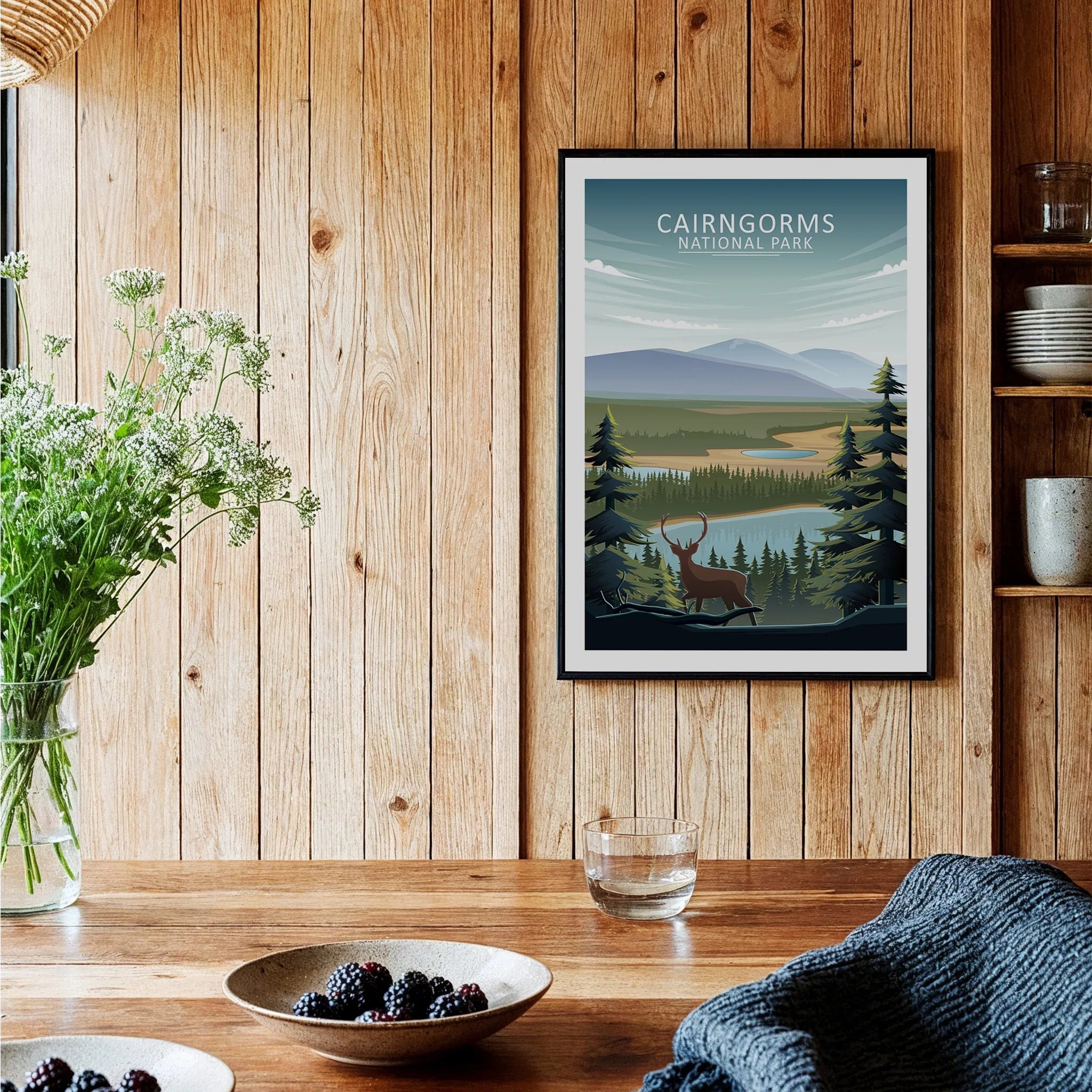 Framed Cairngorms National Park travel art print in rustic kitchen wall decor setting.