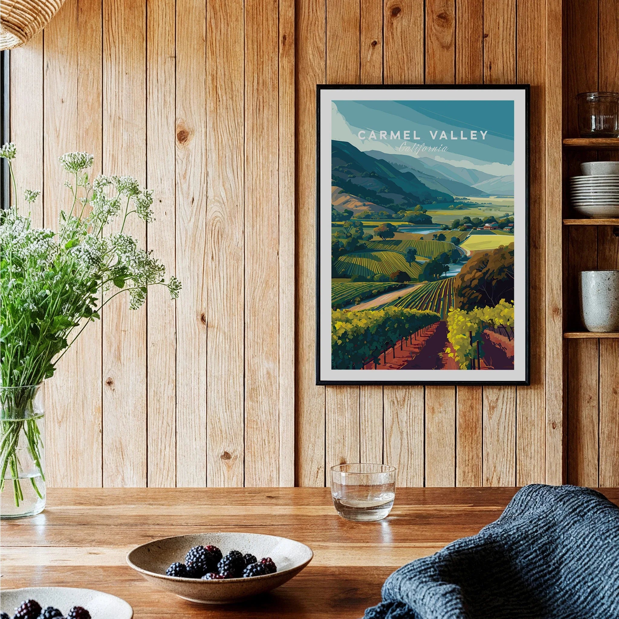 Carmel Valley art print with vineyard landscape in a modern kitchen with wood panel walls.