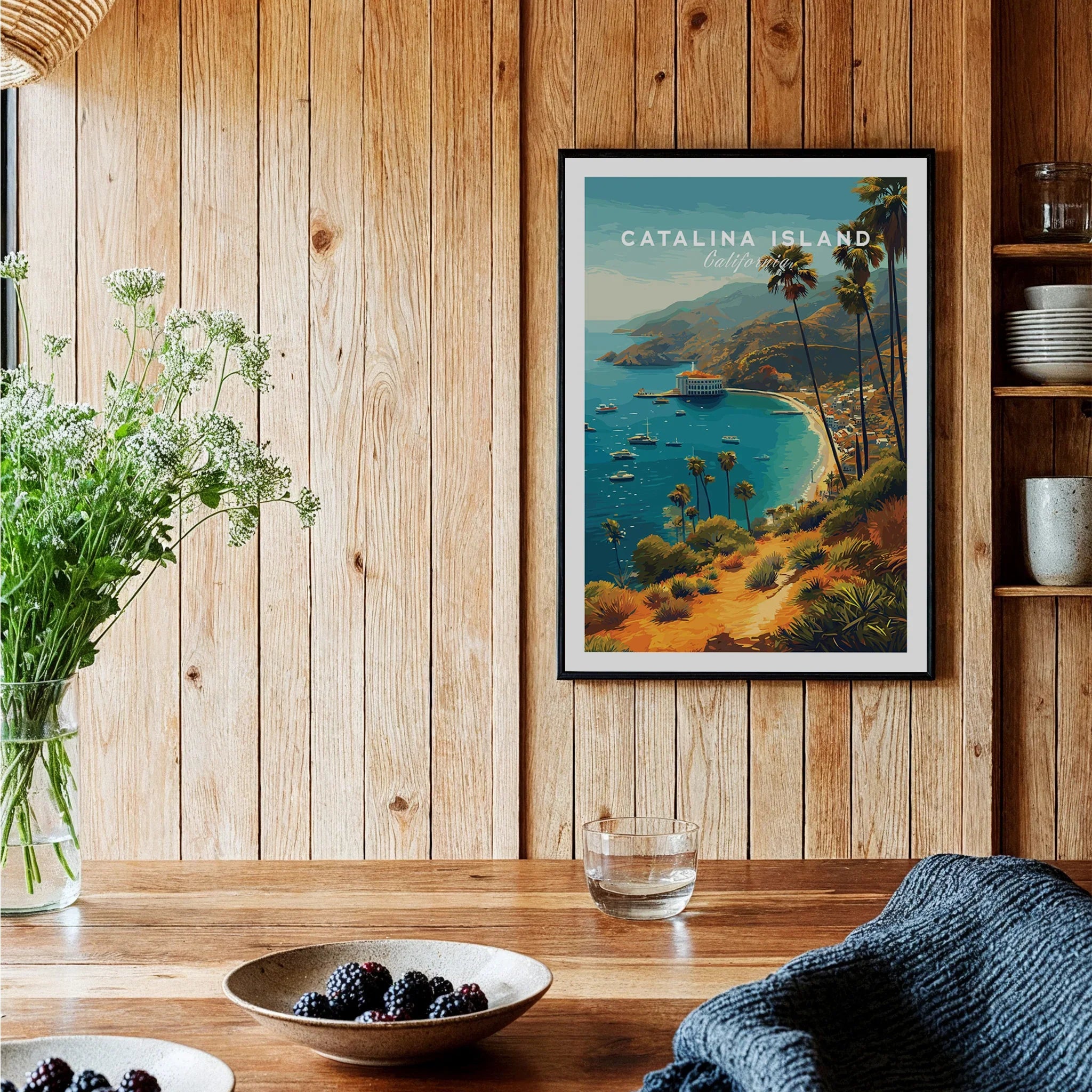 Catalina Island art print with coastal scene in a black frame, displayed in kitchen decor