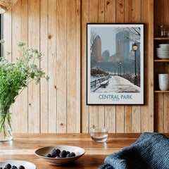 Central Park art print with winter city skyline in black frame, hanging in a rustic kitchen.