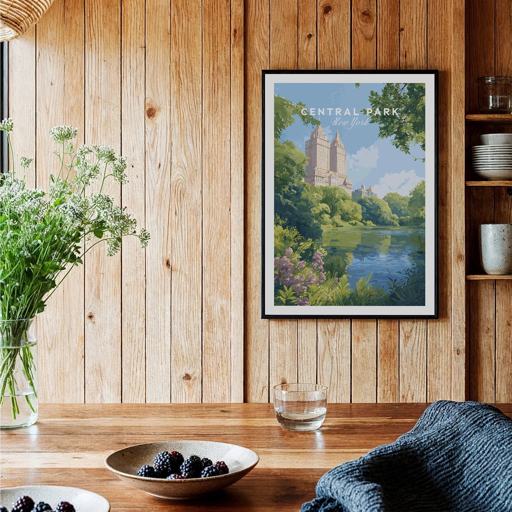Central Park art print in black frame hanging on wood wall in modern kitchen decor setting