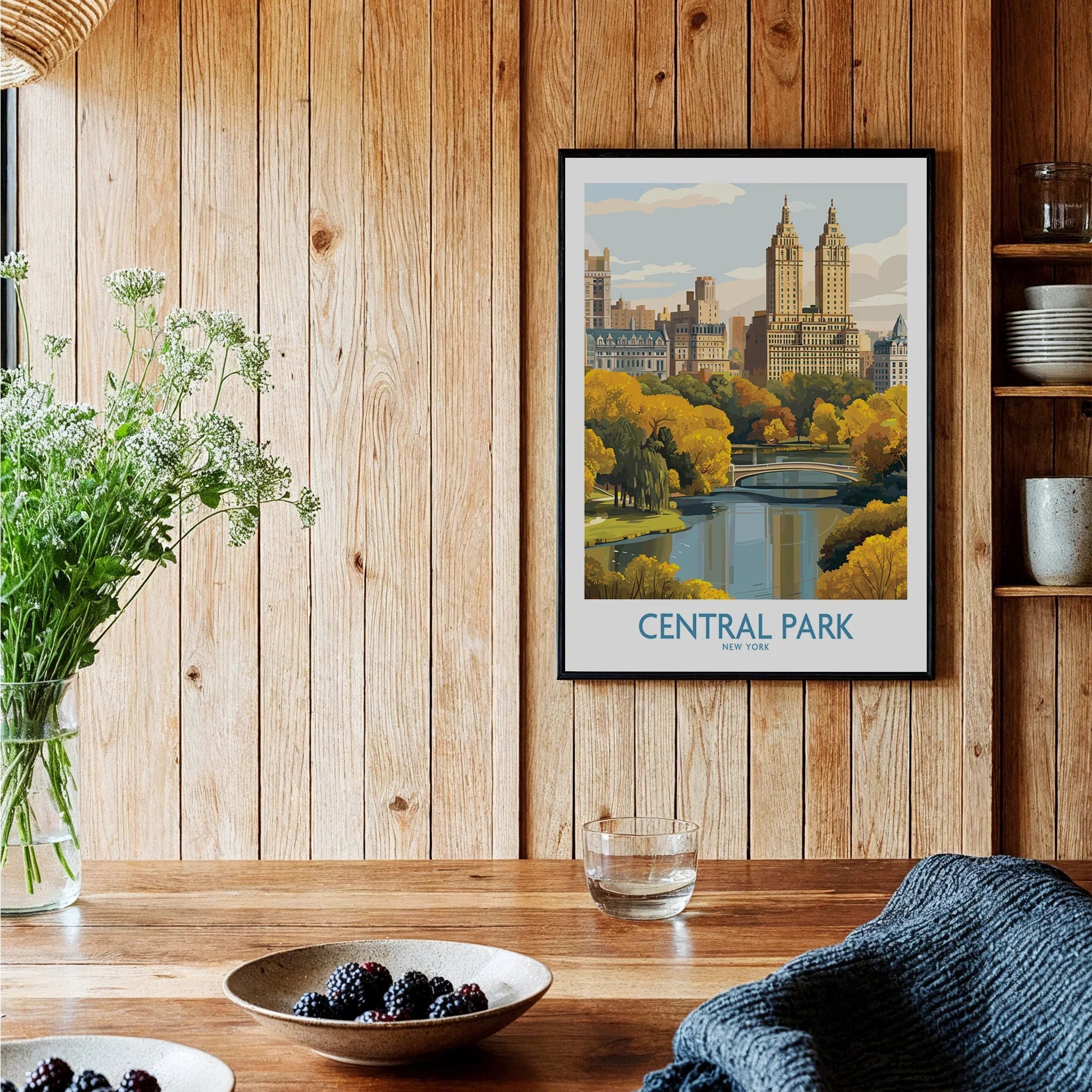 Central Park New York art print in black frame hanging in rustic kitchen setting