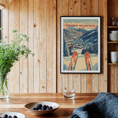 Copper Mountain Travel Poster – Sunset Ski Slopes framed on a wooden wall with ski equipment and decor.