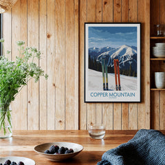 Copper Mountain Ski Wall Art Ski Print featuring vibrant skis against a backdrop of snow-covered peaks in a cozy interior.