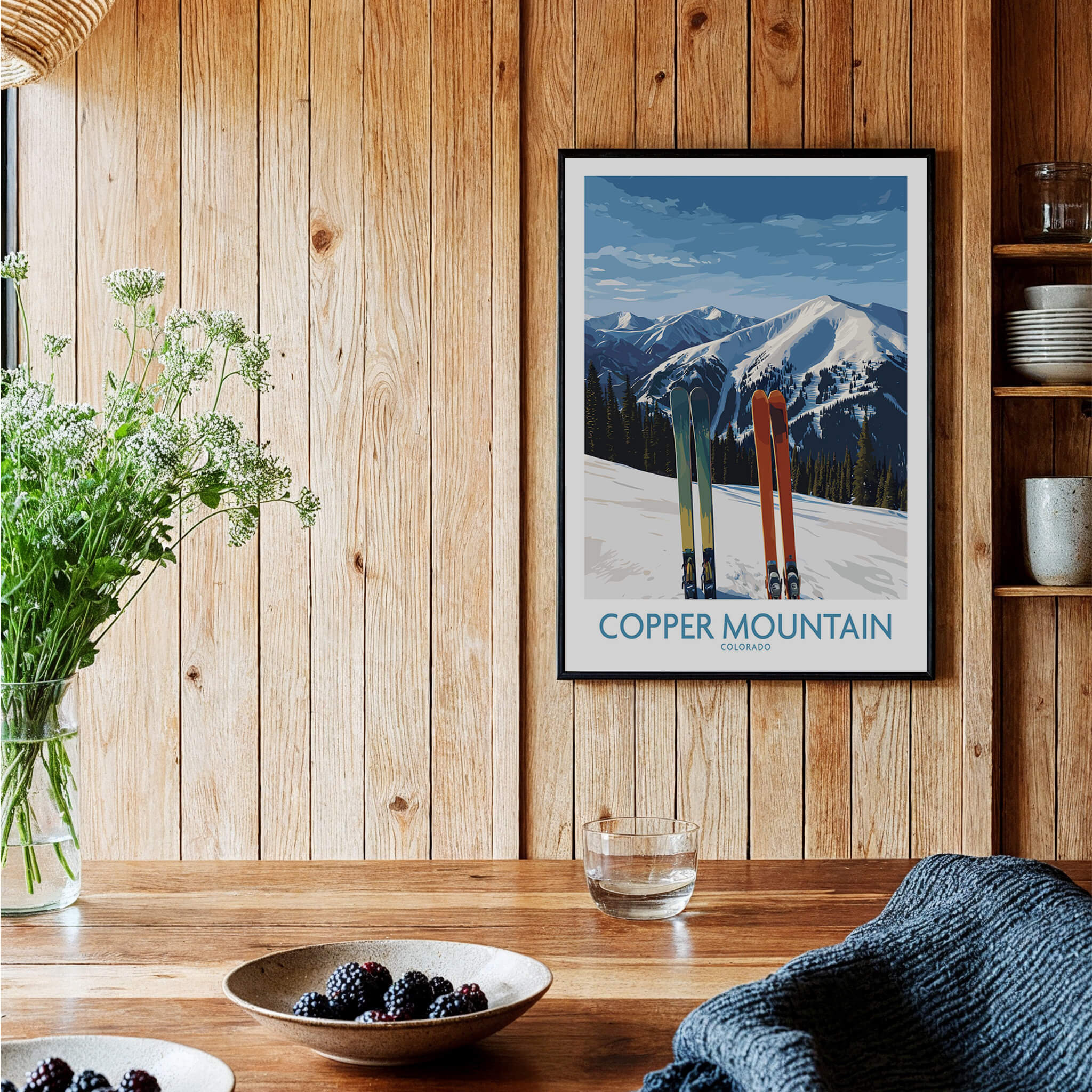 Copper Mountain Ski Wall Art Ski Print featuring vibrant skis against a backdrop of snow-covered peaks in a cozy interior.