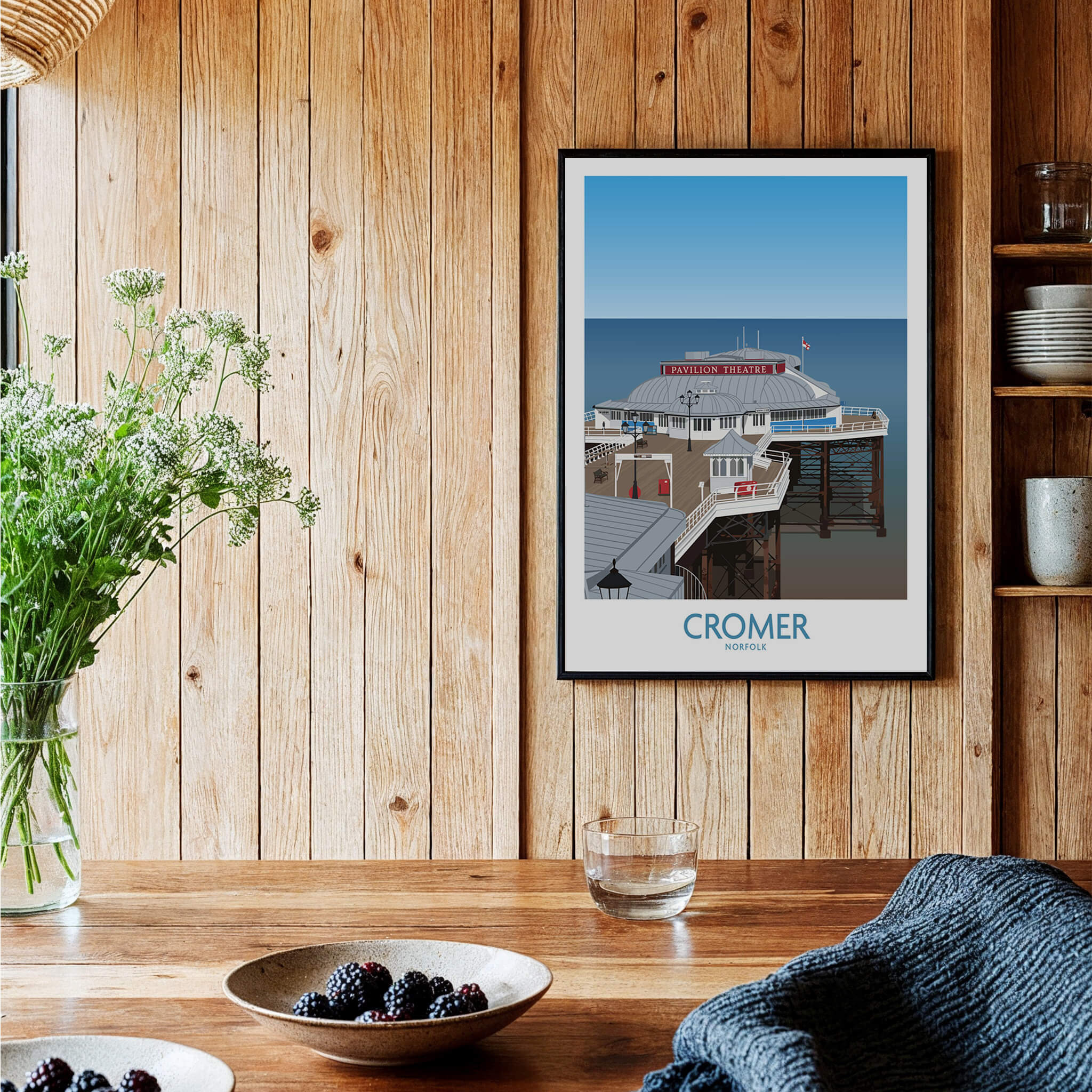 Cromer Norfolk Wall Art – Historic Seaside Pier Art Print displayed on wooden wall in a cozy interior.