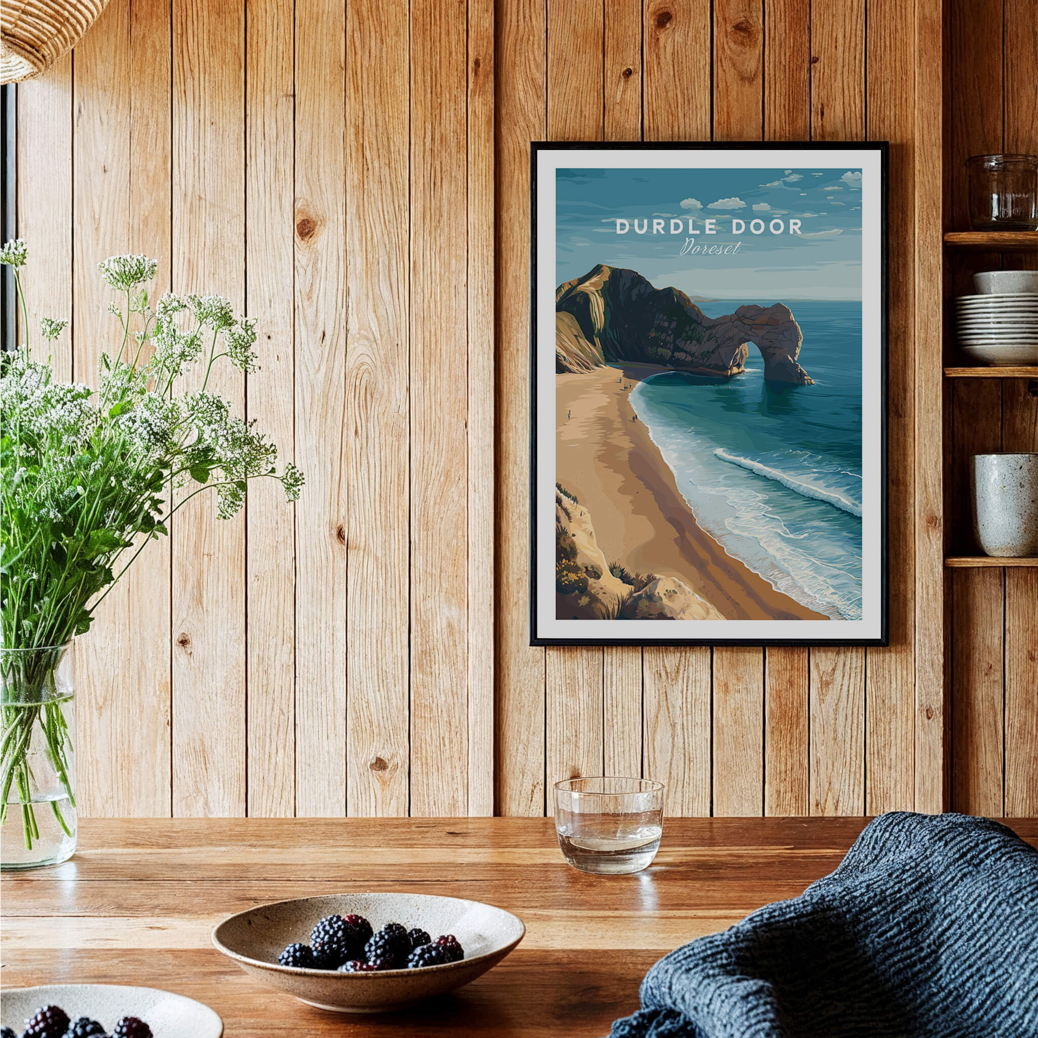 Durdle Door Poster – Jurassic Coast Wall Art displayed on wooden wall with coastal scenery.