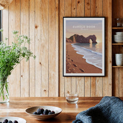 Durdle Door Travel Poster – Jurassic Coast Sunset Art displayed in a cozy setting with coastal elements.