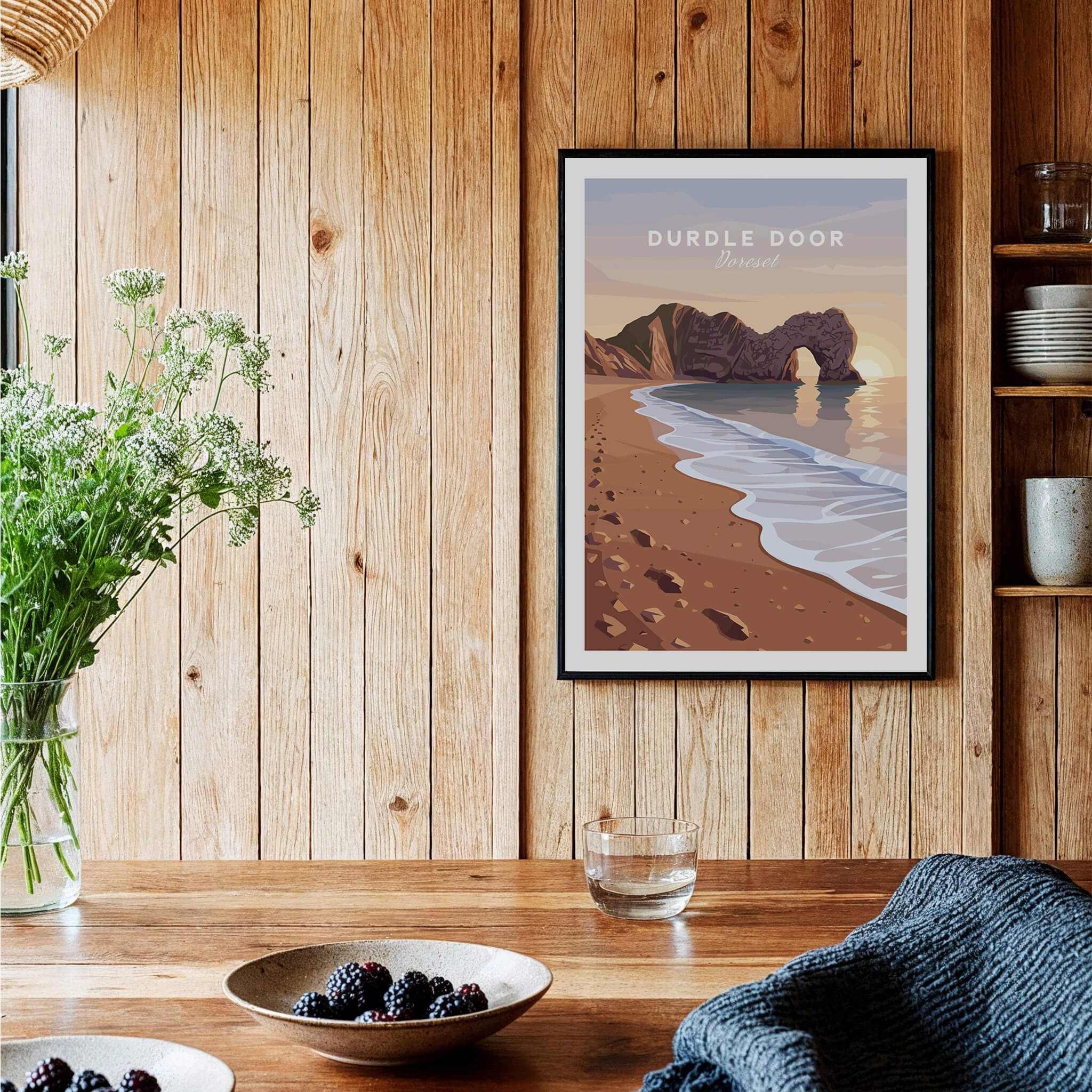 Durdle Door Travel Poster – Jurassic Coast Sunset Art displayed in a cozy setting with coastal elements.