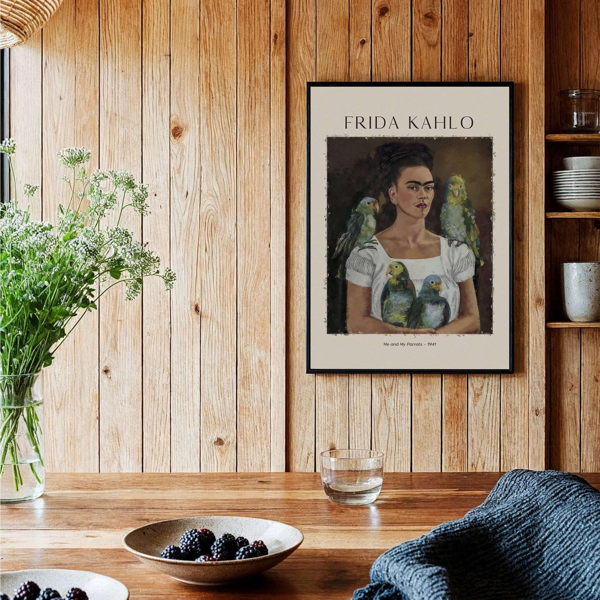 Frida Kahlo Me and My Parrots Self Portrait Art Print Poster Wall Art displayed on a wooden wall with greenery.