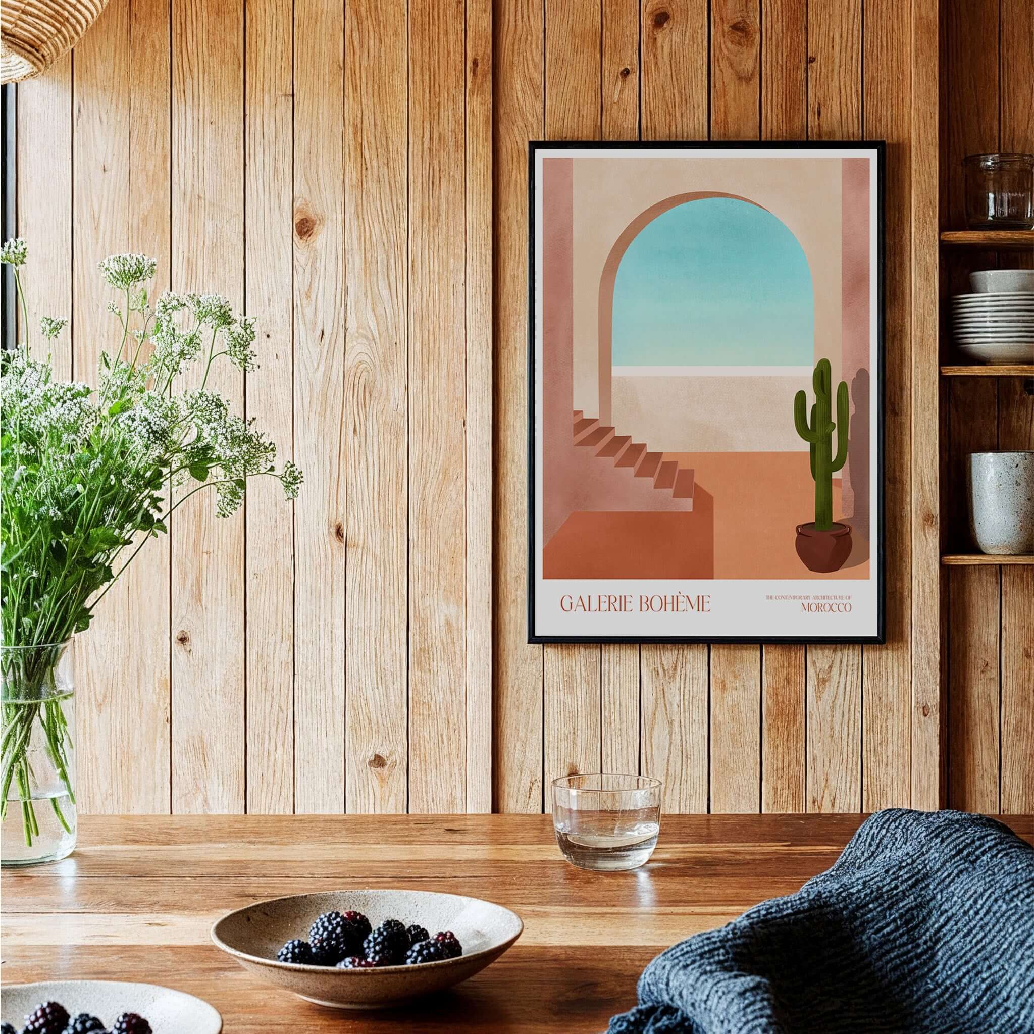 Galerie Bohème Moroccan Archway Cactus Art Print Terracotta Wall Decor Poster on wooden wall in a cozy kitchen setting.