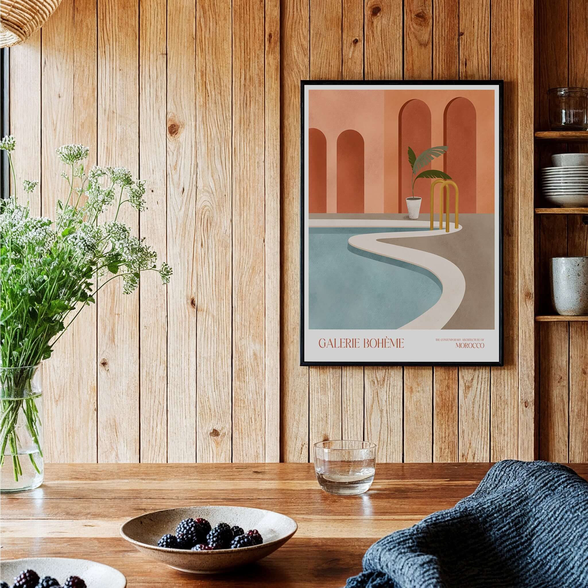 Galerie Bohème Poolside Morocco Architecture Poster Minimalist Wall Art Print framed in a wooden interior with plants.