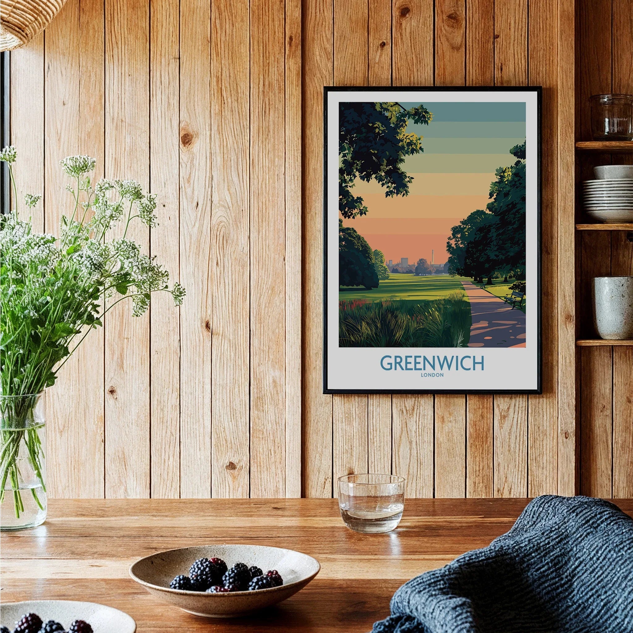 Greenwich London travel poster wall art in a cozy wood kitchen setting with fruit bowls.