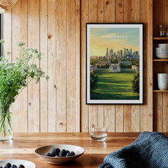 Greenwich London skyline art print in black frame, displayed above rustic kitchen table