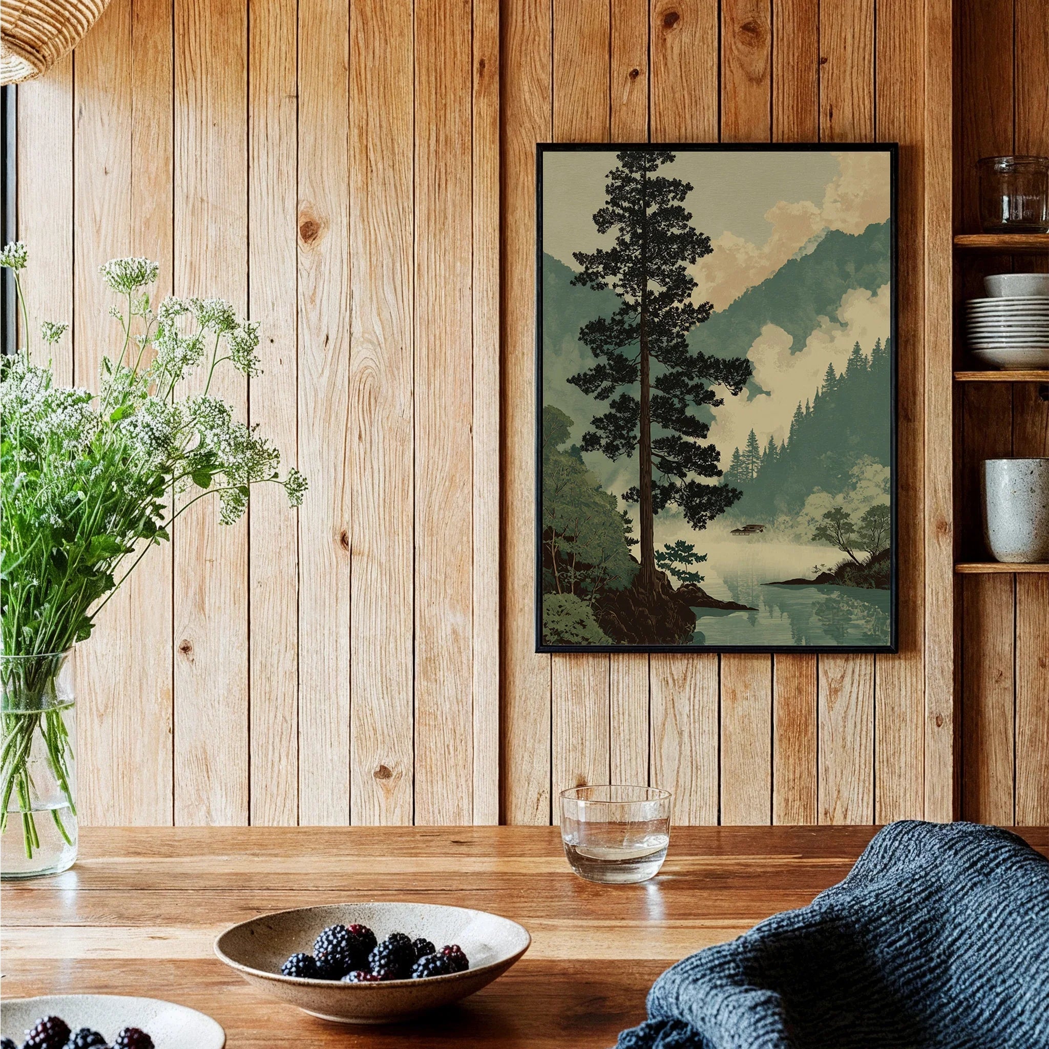 Framed Japanese woodblock art print of a misty mountain landscape in a cozy kitchen setting.