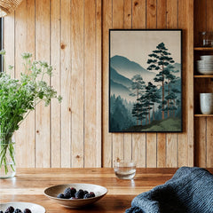 Framed Japanese woodblock art print of pine trees and misty mountains in rustic kitchen setting.