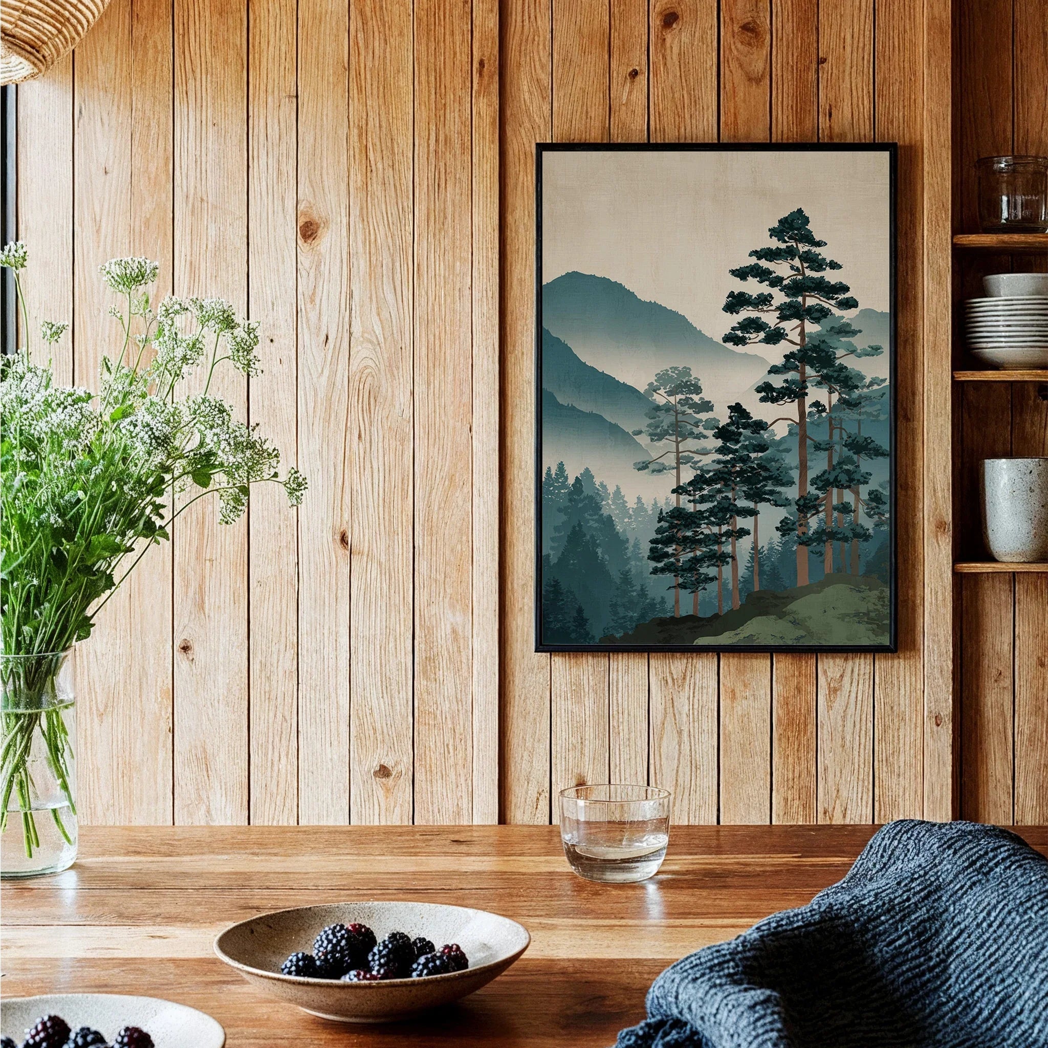 Framed Japanese woodblock art print of pine trees and misty mountains in rustic kitchen setting.