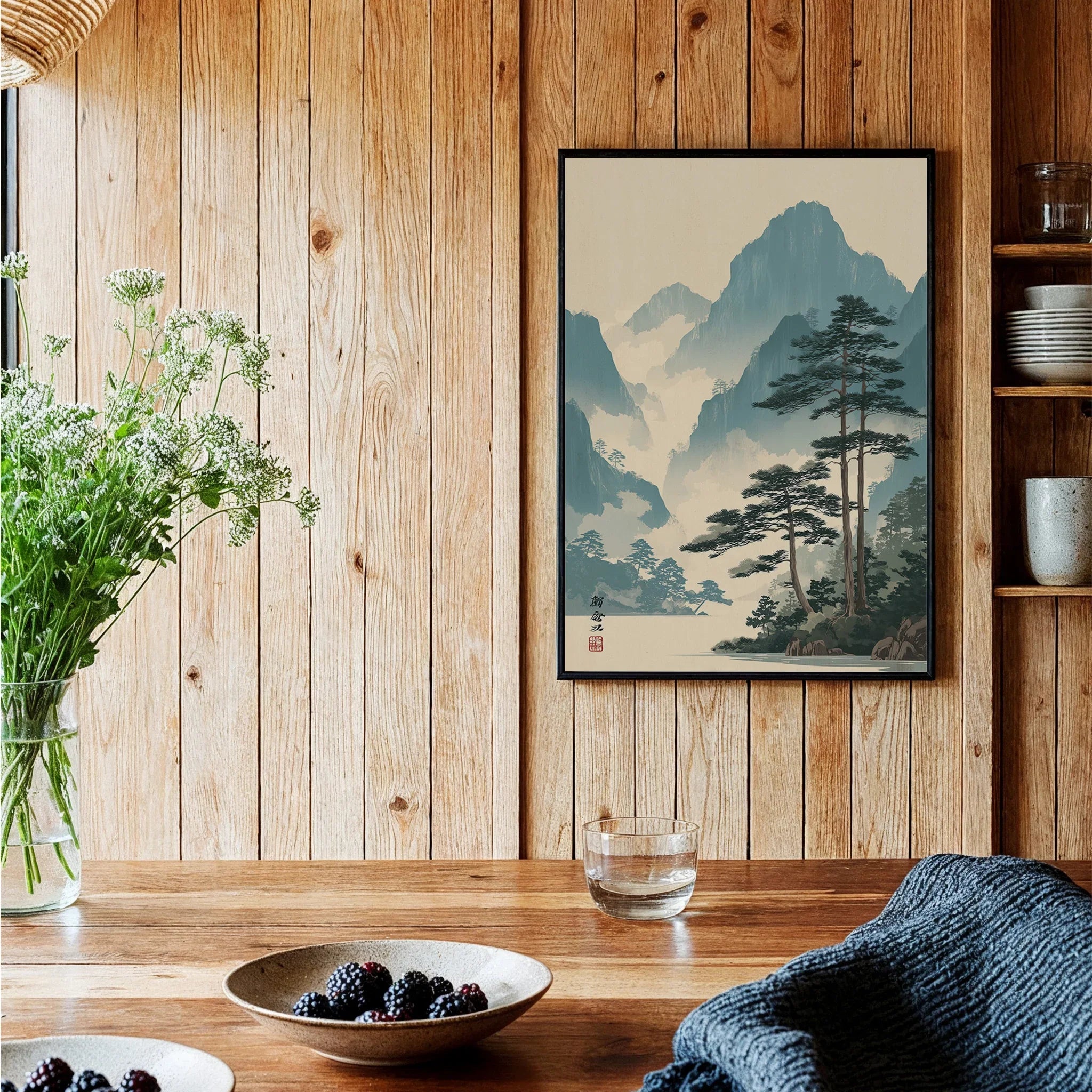 Framed Japanese woodblock landscape art print on wooden kitchen wall with rustic decor