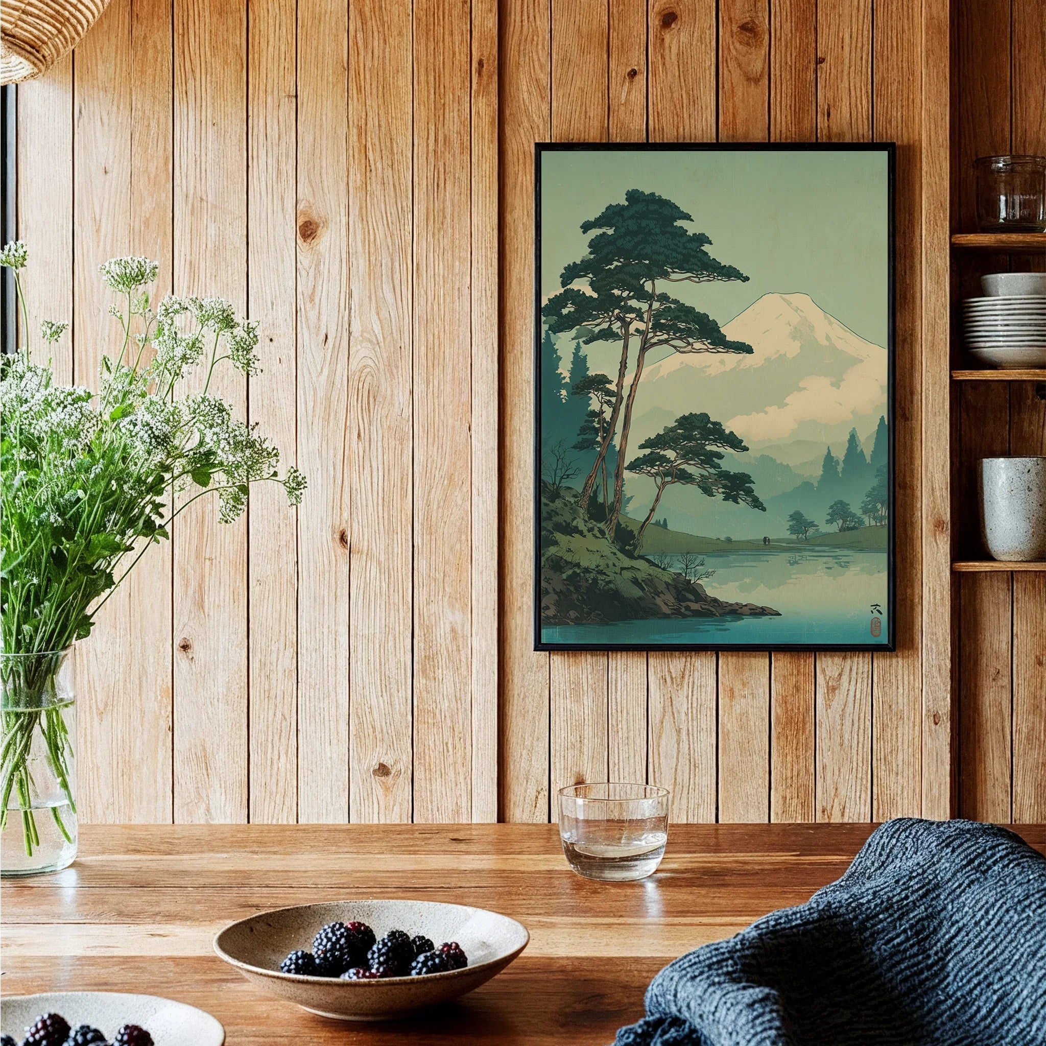 Framed Japanese woodblock art print with mountain and trees in cozy kitchen decor setting