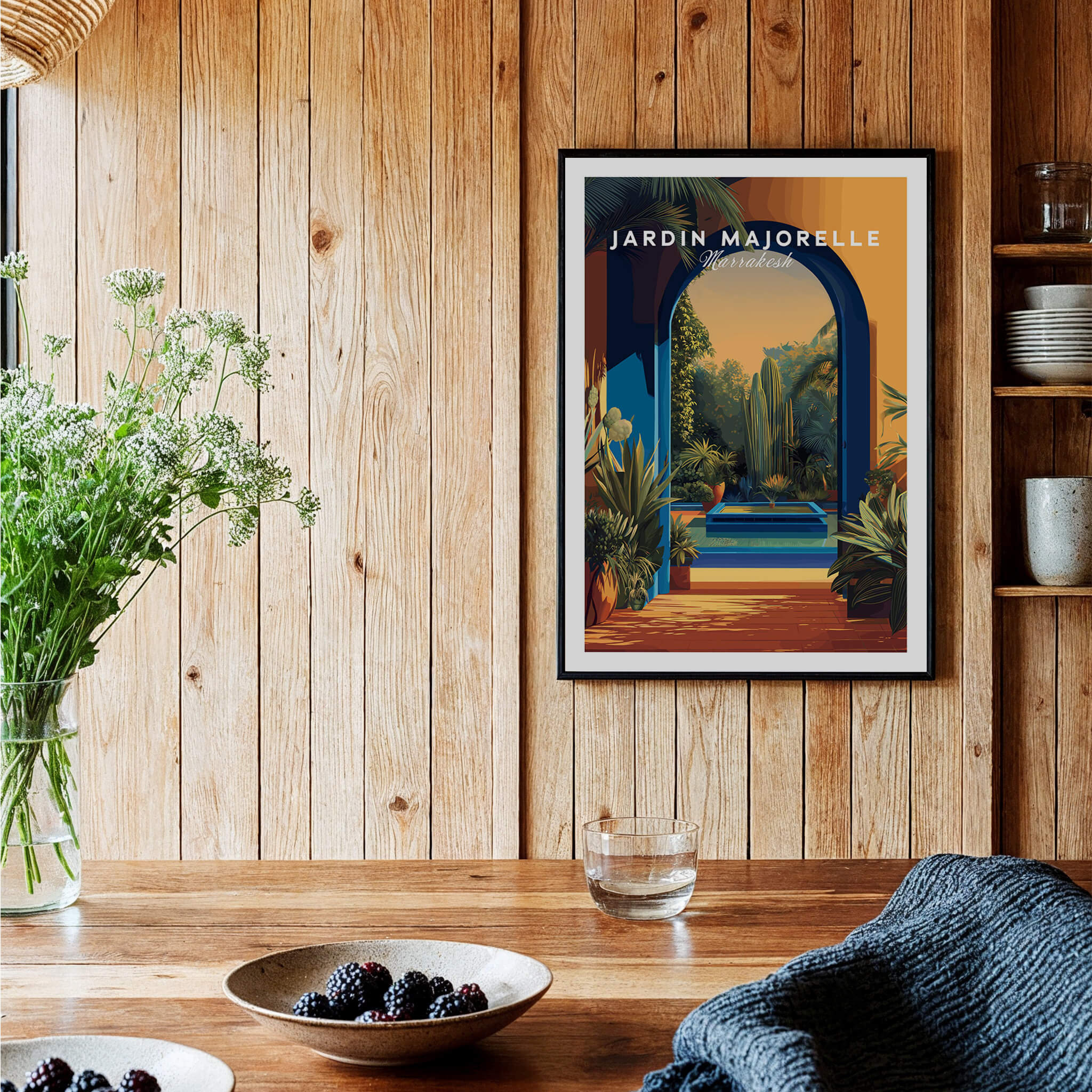 Jardim Majorelle Marrakesh Travel Posters | Garden Fountain Scene Wall Art Print on a wooden wall with plants.